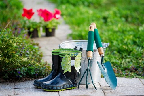 Gardener prepping mower before lawn mowing job
